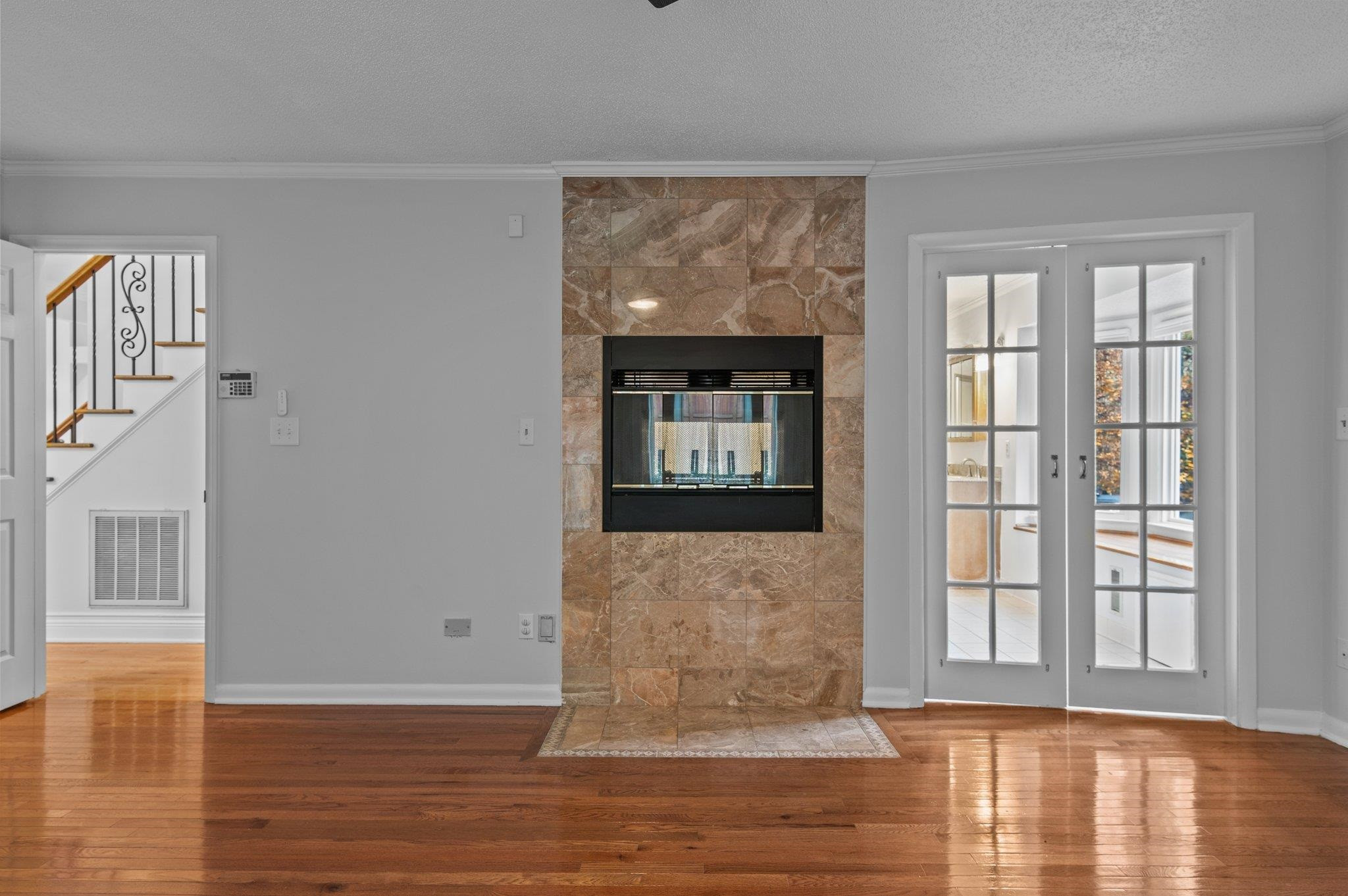 5808 Glenfiddich Way Raleigh, NC 27613 - Photo 49 of 64 a view of an empty room with wooden floor and a window