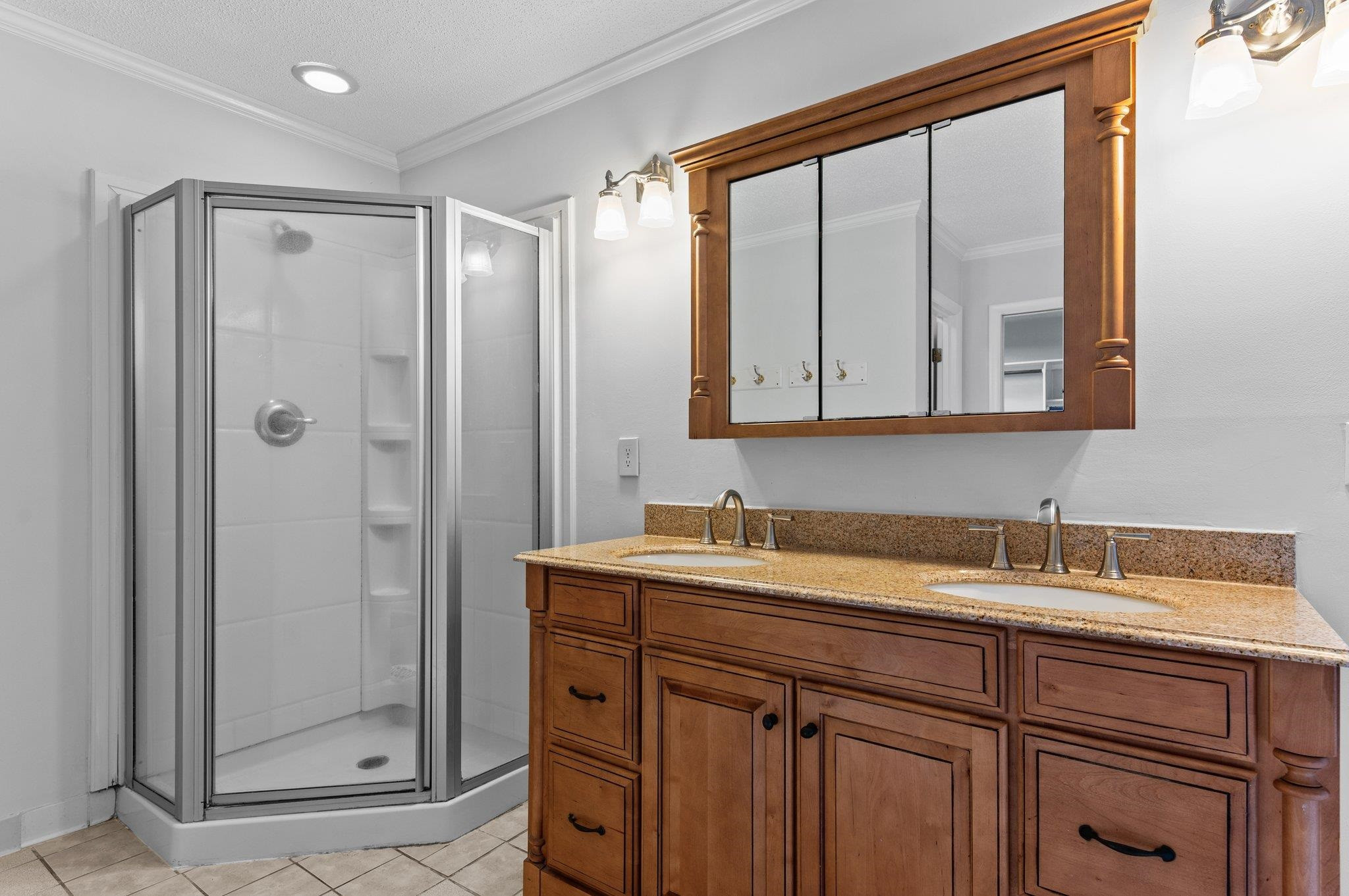 5808 Glenfiddich Way Raleigh, NC 27613 - Photo 51 of 64 a bathroom with a double vanity sink mirror and shower