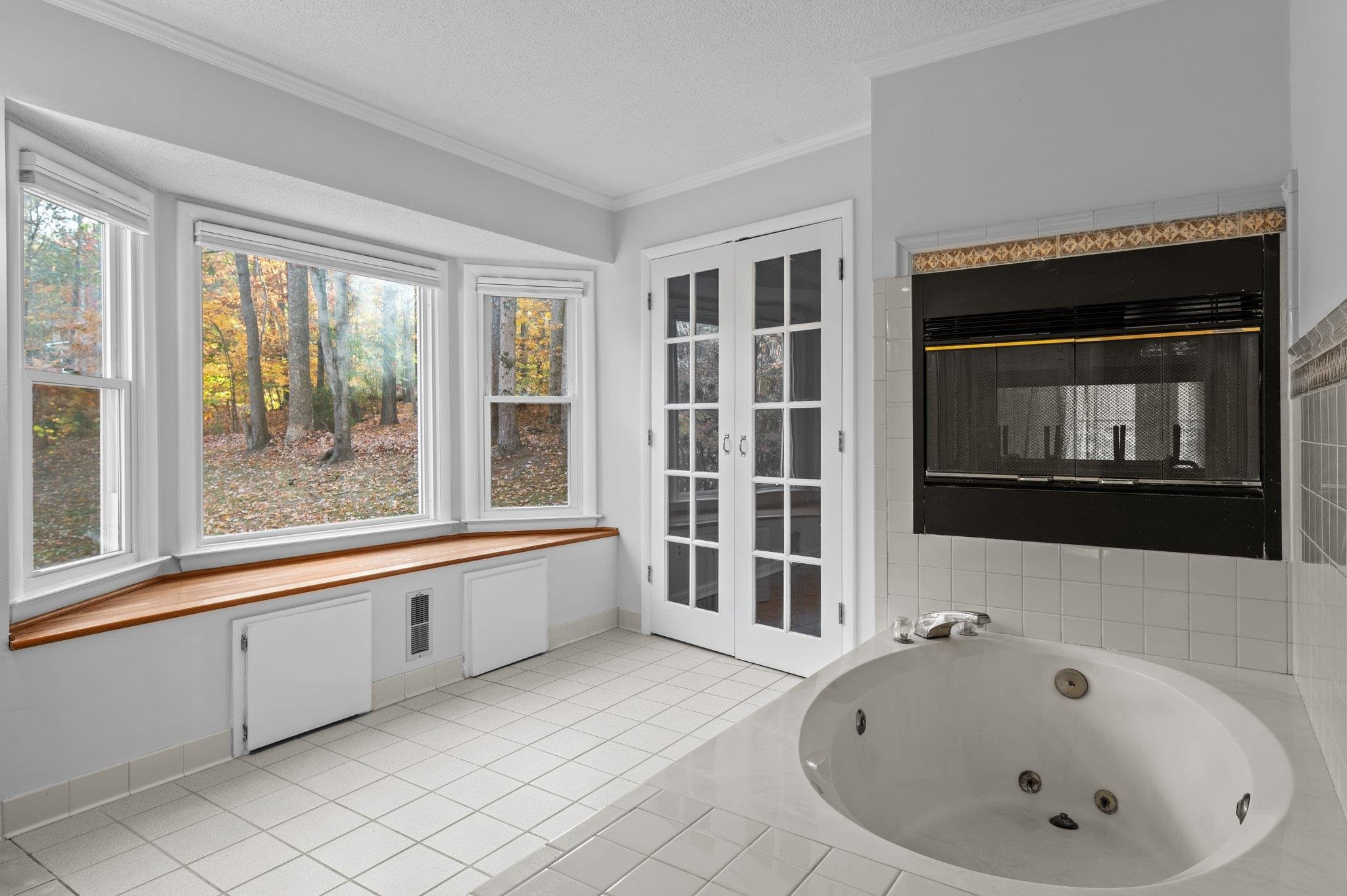 5808 Glenfiddich Way Raleigh, NC 27613 - Photo 53 of 64 a bathroom with a bathtub and a window
