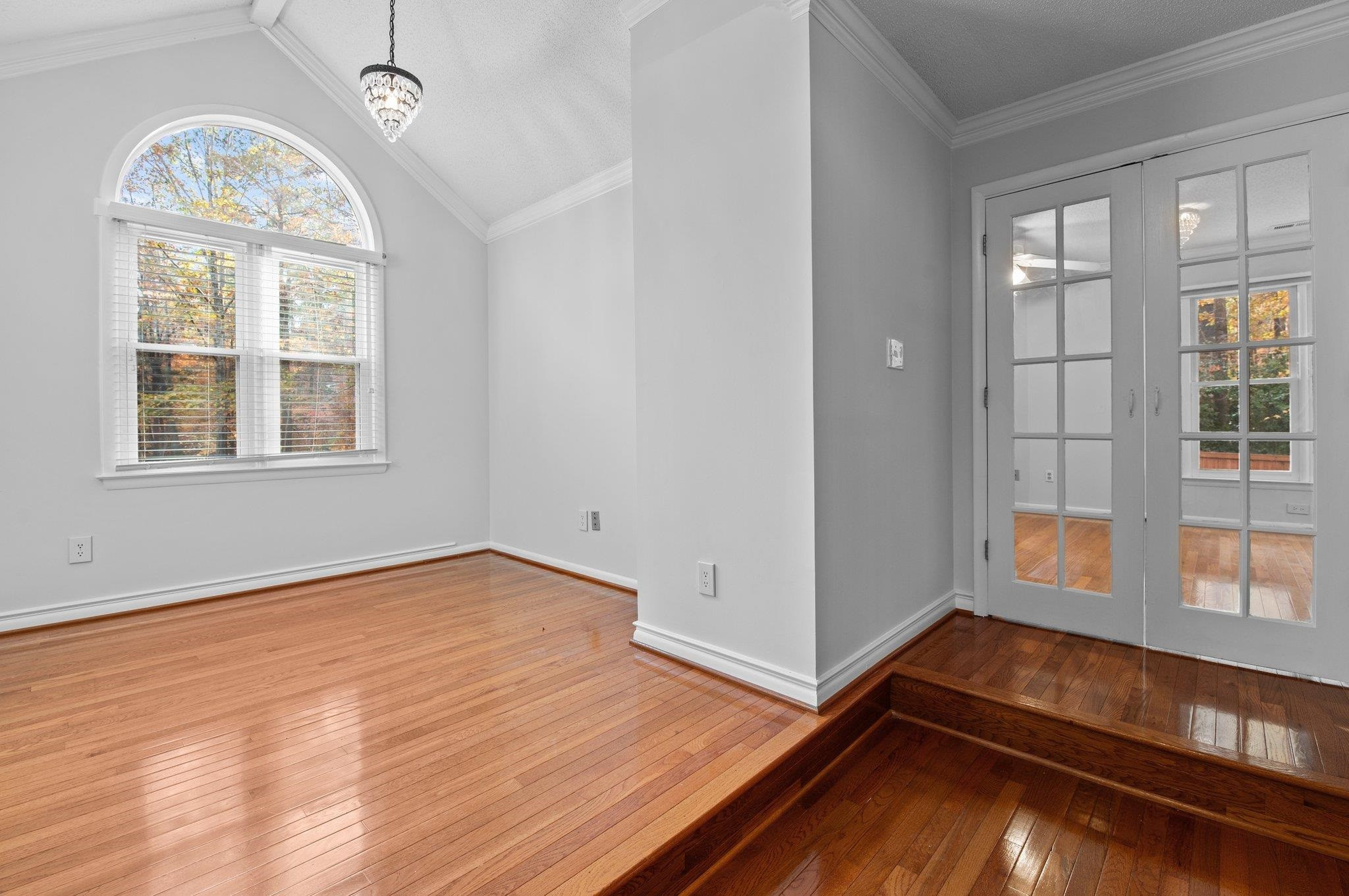 5808 Glenfiddich Way Raleigh, NC 27613 - Photo 56 of 64 an empty room with wooden floor and windows