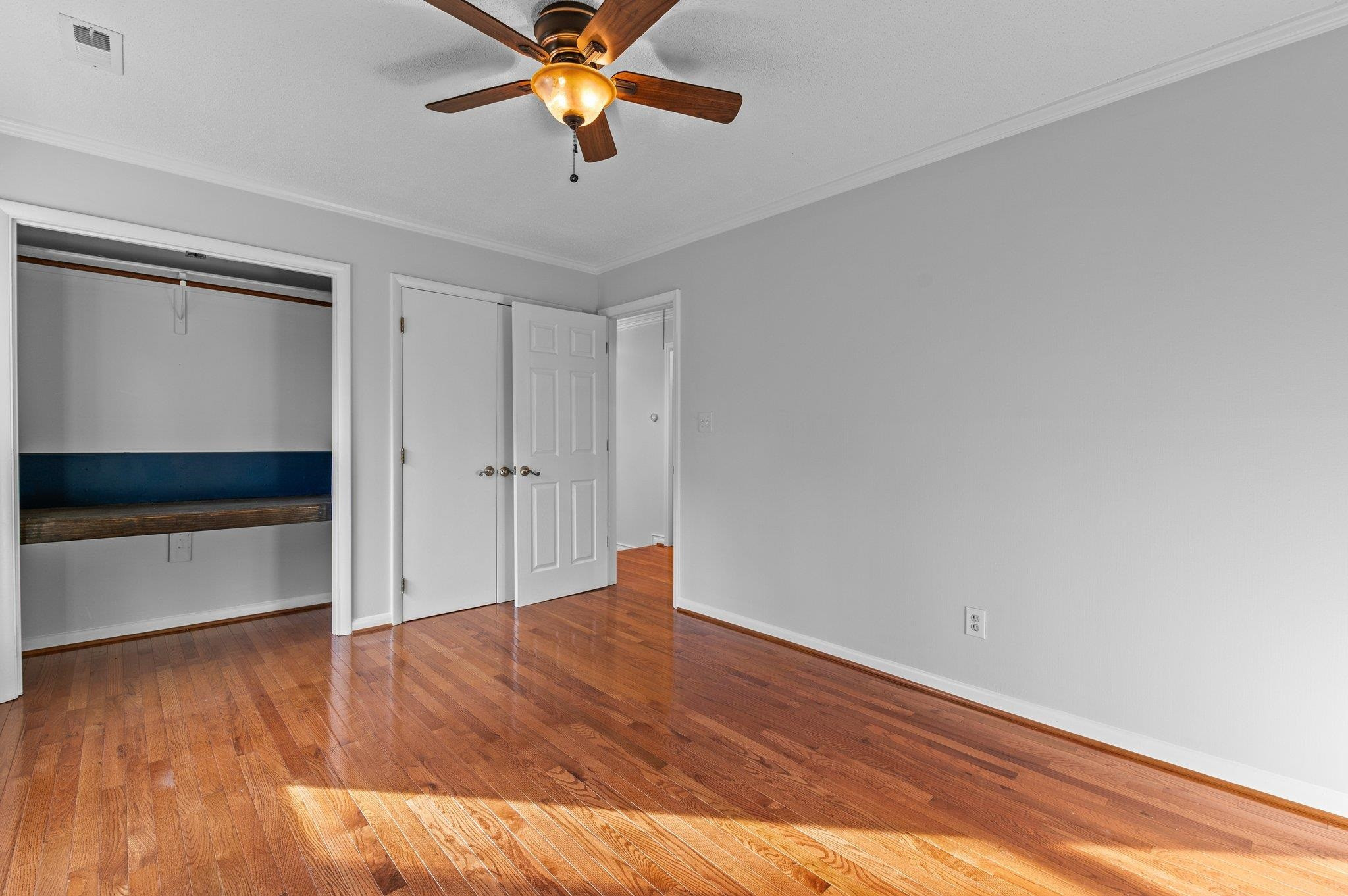 5808 Glenfiddich Way Raleigh, NC 27613 - Photo 61 of 64 wooden floor in an empty room with a window