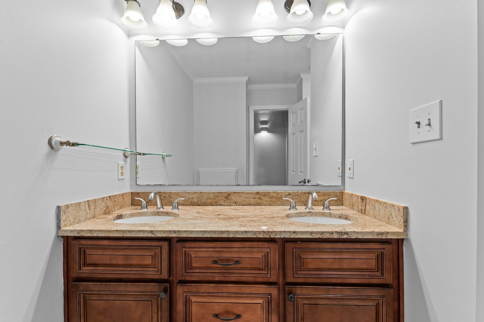 5808 Glenfiddich Way Raleigh, NC 27613 - Photo 63 of 64 a bathroom with a sink and a mirror