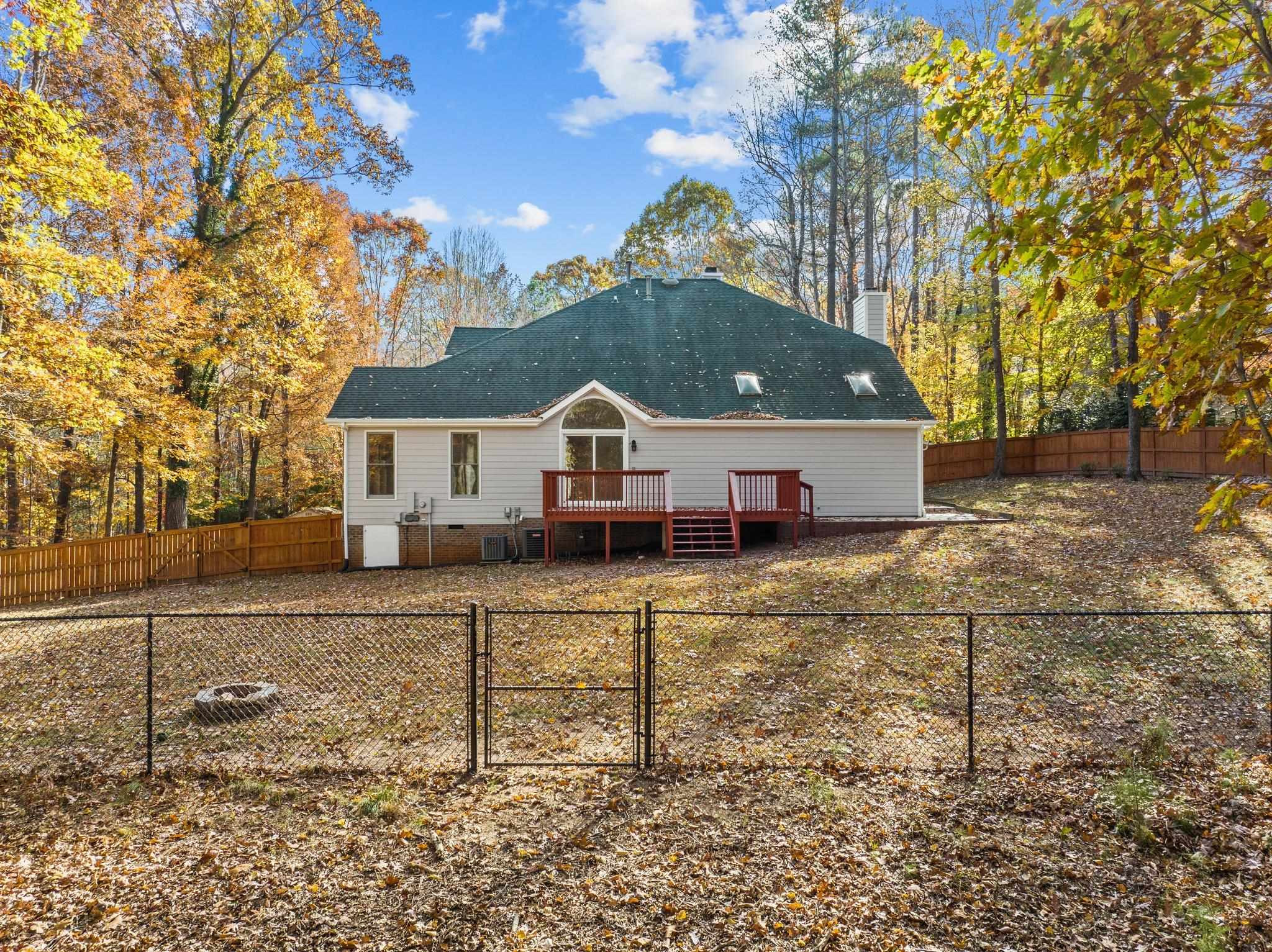 5808 Glenfiddich Way Raleigh, NC 27613 - Photo 8 of 64 a aerial view of a house with a yard