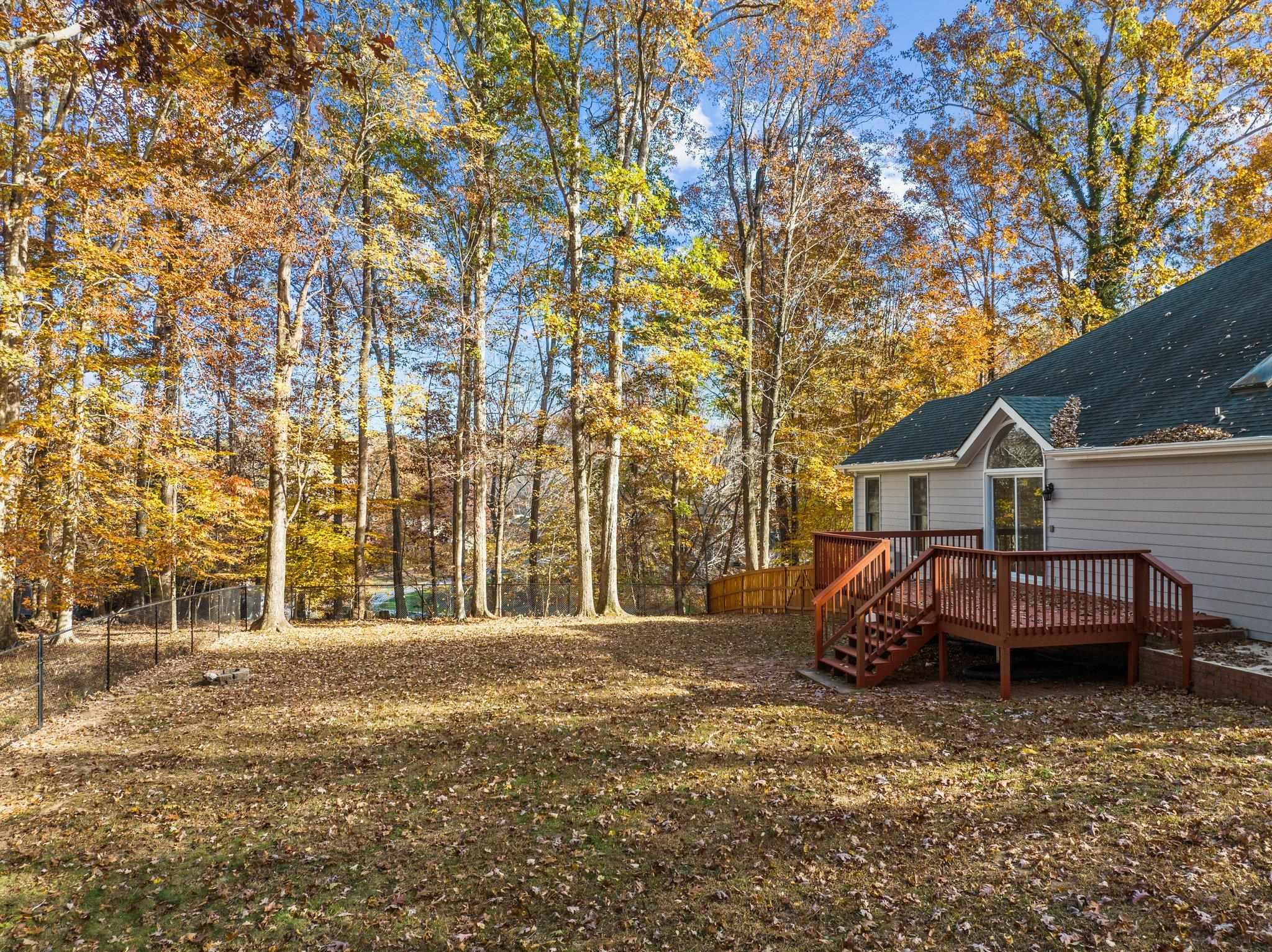 5808 Glenfiddich Way Raleigh, NC 27613 - Photo 10 of 64 a front view of a house with a yard