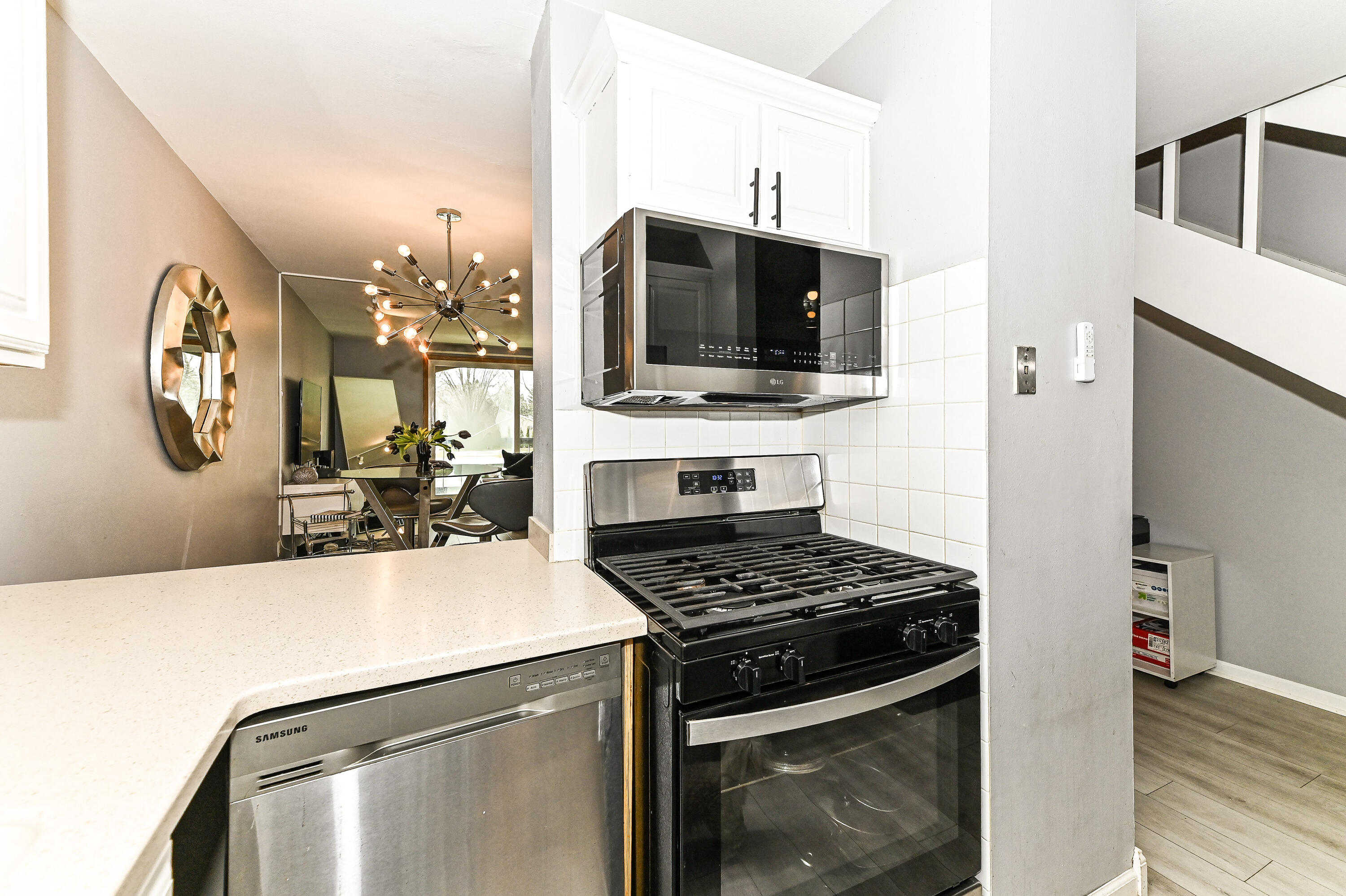 11926 West Mill Road, Unit 4 Milwaukee, WI 53225 - Photo 3 of 34 The kitchen has a pass-through to the dining area