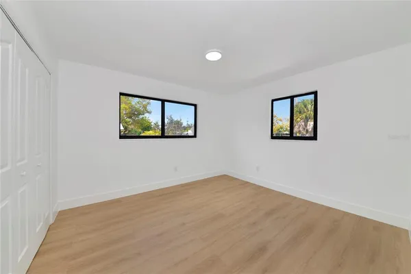a view of empty room with windows