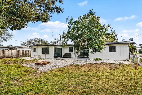a house with trees in the background