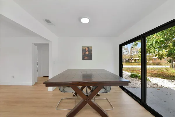 a view of a workspace with furniture and window