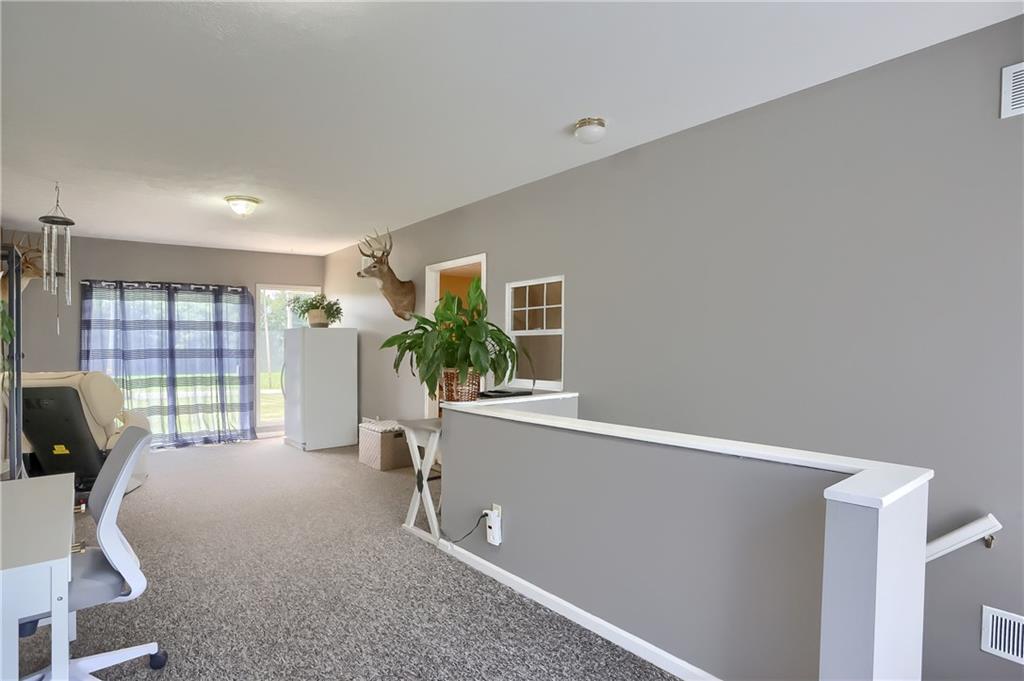 503 Dick Road Butler, PA 16001 - Photo 12 of 27 a living room with furniture and a flat screen tv