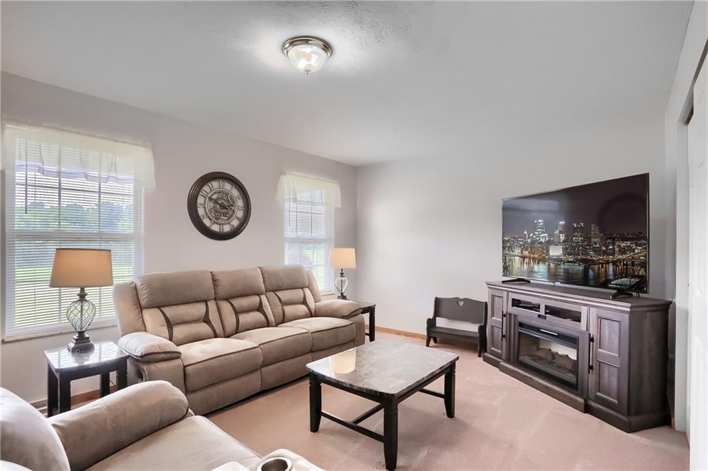 503 Dick Road Butler, PA 16001 - Photo 13 of 27 a living room with furniture and a flat screen tv