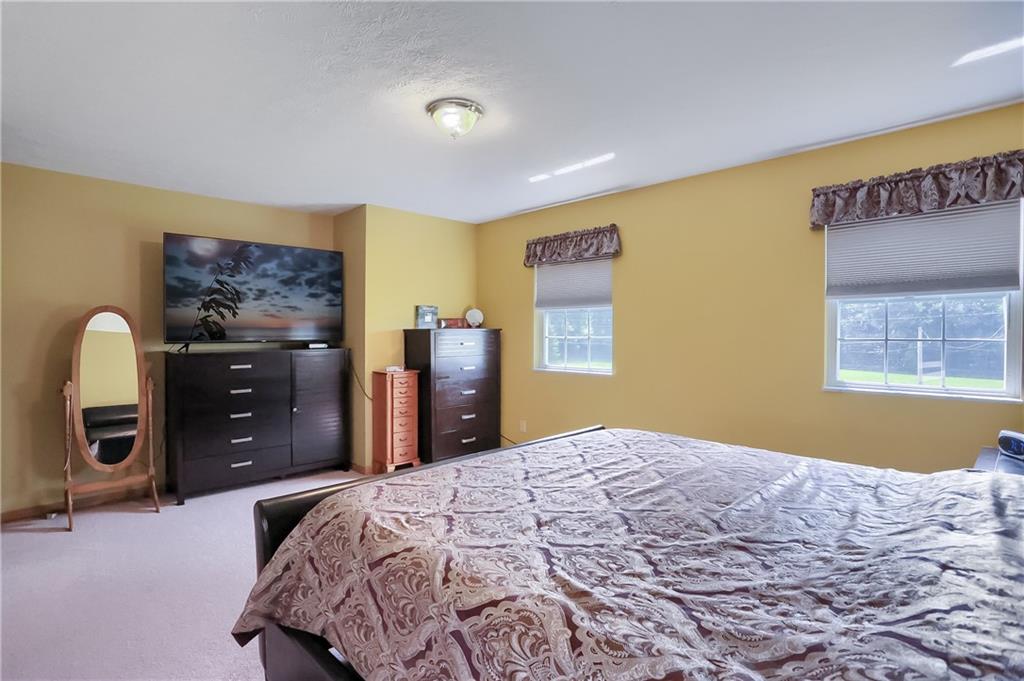 503 Dick Road Butler, PA 16001 - Photo 17 of 27 a bedroom with a bed and a dresser