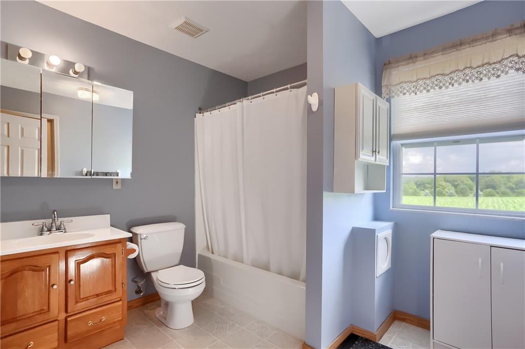503 Dick Road Butler, PA 16001 - Photo 18 of 27 a bathroom with a toilet sink and mirror