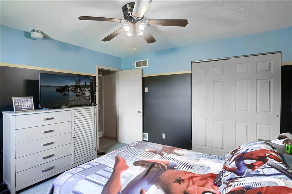 503 Dick Road Butler, PA 16001 - Photo 19 of 27 a bedroom with a bed and a television