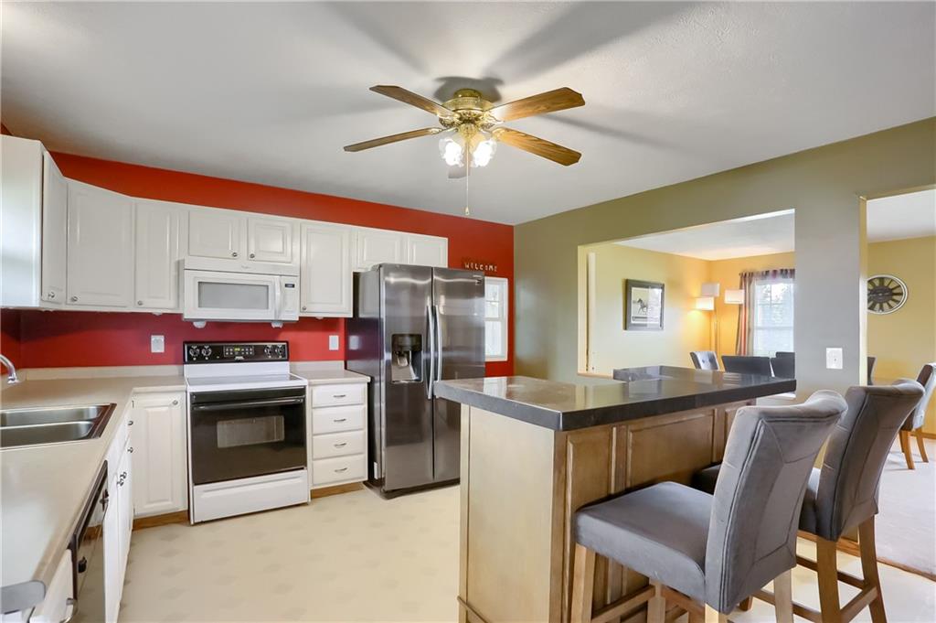 503 Dick Road Butler, PA 16001 - Photo 5 of 27 a kitchen with stainless steel appliances granite countertop a stove a sink and a refrigerator