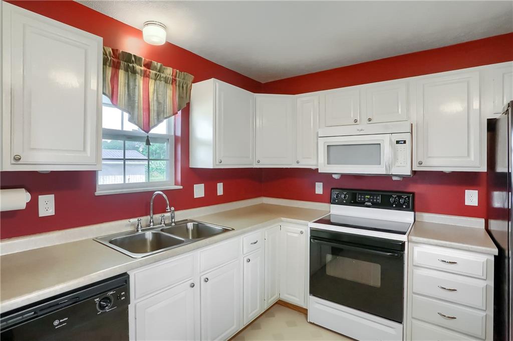 503 Dick Road Butler, PA 16001 - Photo 6 of 27 a kitchen with granite countertop a sink stainless steel appliances and cabinets