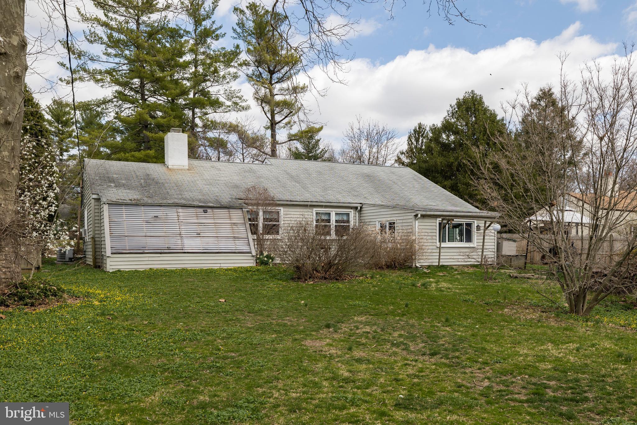 84 Conestoga Road Malvern, PA 19355 - Photo 15 of 41 Exterior back w/attached greenhouse