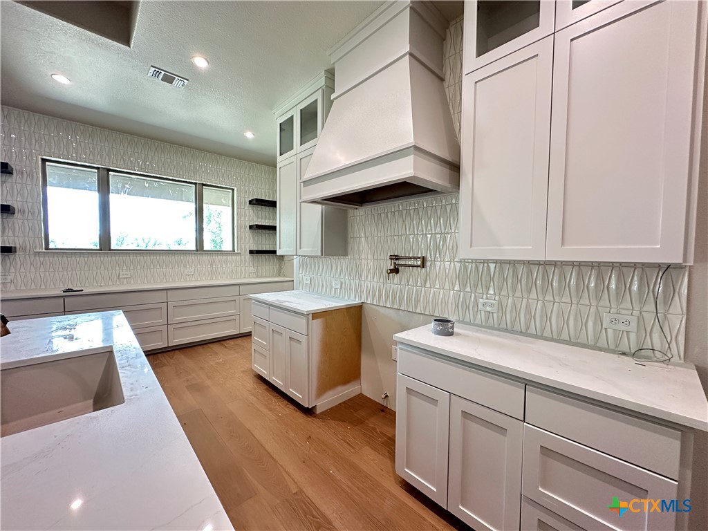 418 Dos Rios Drive Belton, TX 76513 - Photo 7 of 41 a kitchen with a sink cabinets and window