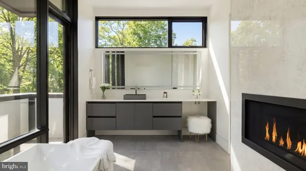 a bedroom with a large bed and a large window