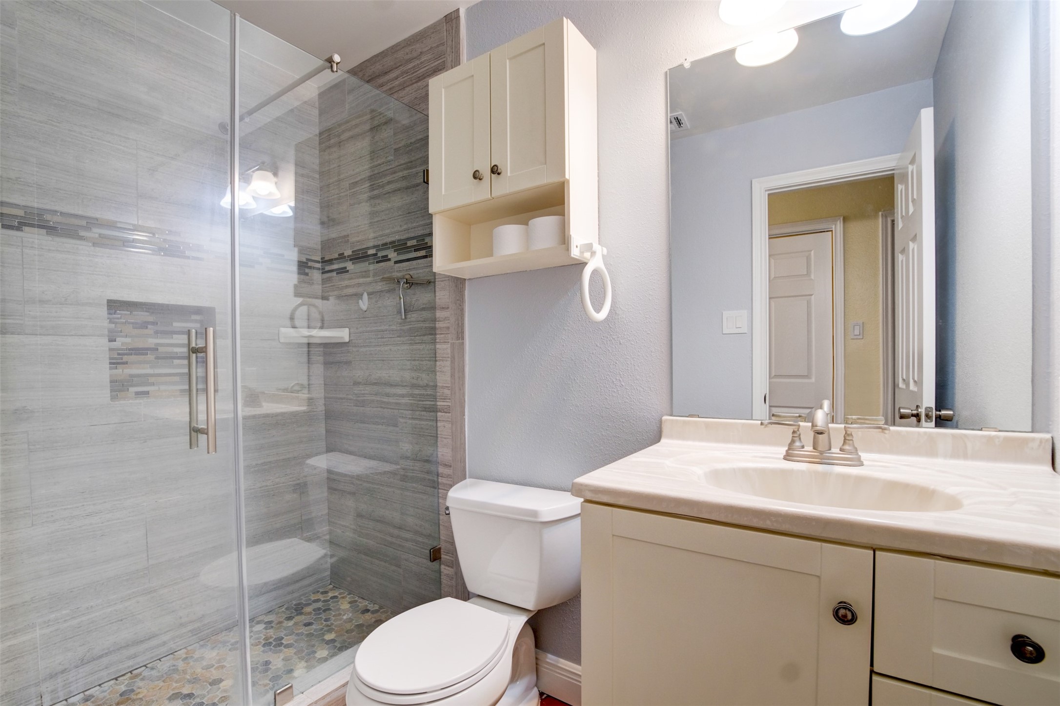 11840 Spring Grove Drive Houston, TX 77099 - Photo 12 of 27 Beautifully renovated bathroom with designer tile work
