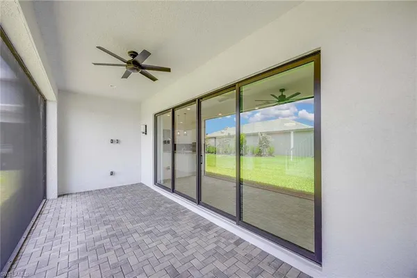 a view of room with window and ceiling fan