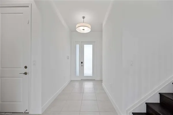 a view of a hallway with an entryway