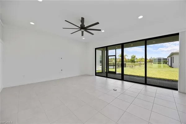 a view of an empty room with a large window