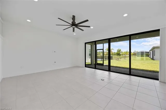 a view of an empty room with a large window