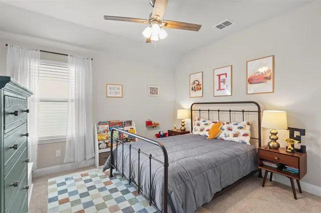 a bedroom with a bed and a table in it