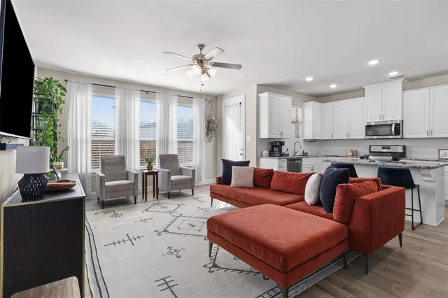 a living room with furniture and a flat screen tv