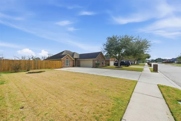 a swimming pool with trees in the background