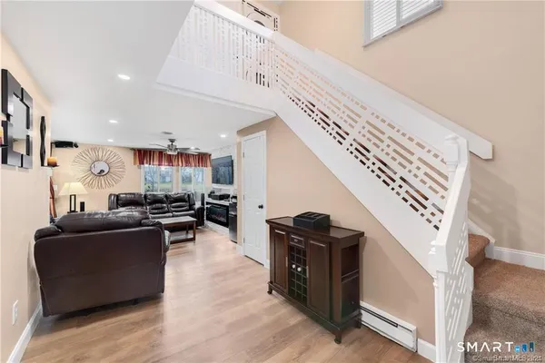 a living room with furniture and a fireplace