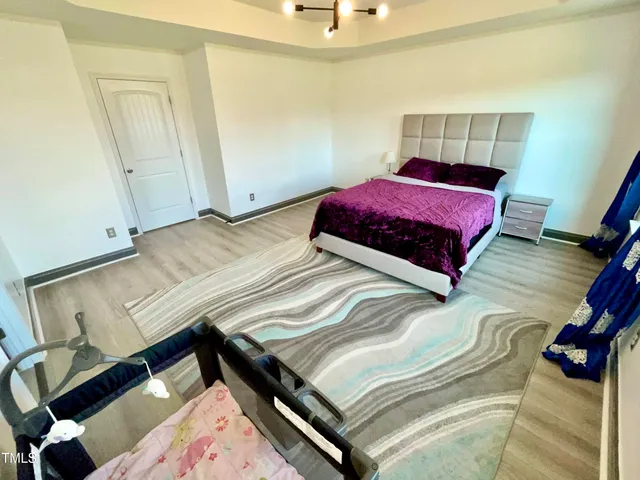 a bedroom with bed and a window