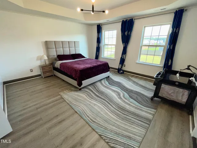 a bathroom with a tub sink and a mirror
