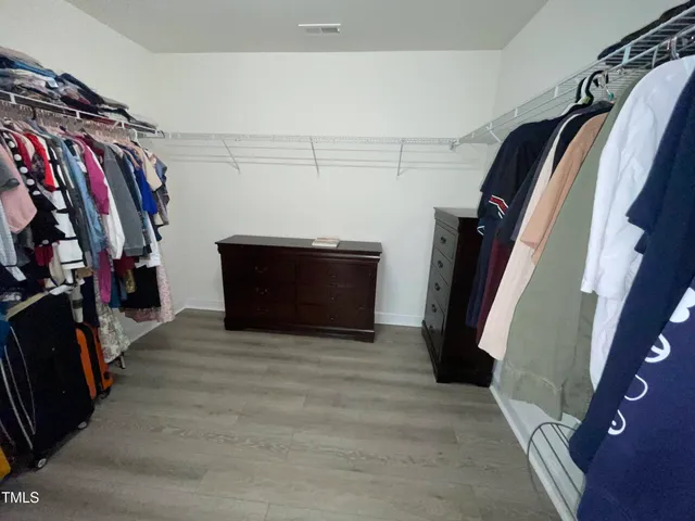 a living room with furniture rug and window