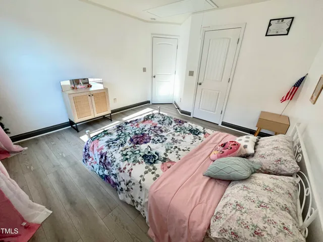 a kitchen with stainless steel appliances kitchen island granite countertop a refrigerator a stove a microwave oven a sink with island and chairs