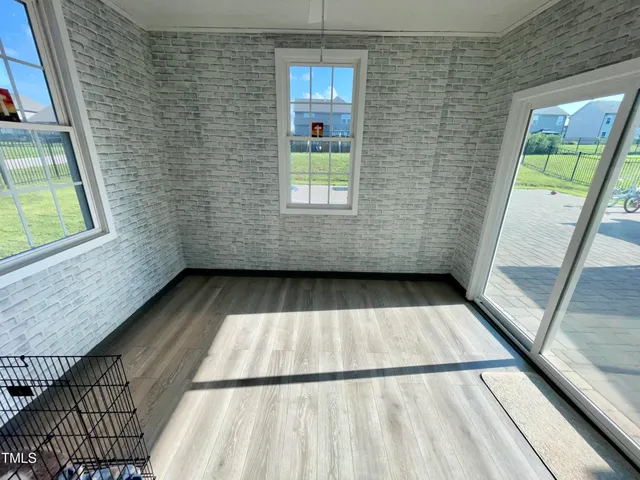 a view of a house with sitting area and garden