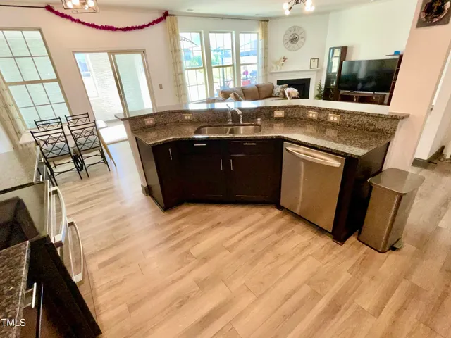 a kitchen with a sink stove and refrigerator