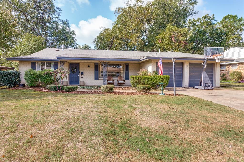 6921 Valhalla Road Fort Worth, TX 76116 - Photo 2 of 25 Single story home with brick siding, covered porch, a front yard, and concrete driveway