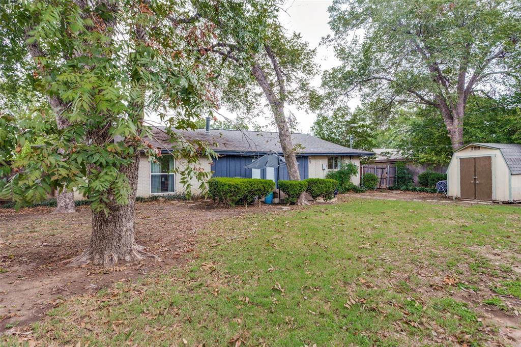 6921 Valhalla Road Fort Worth, TX 76116 - Photo 24 of 25 Back of house with a shed and a shingled roof