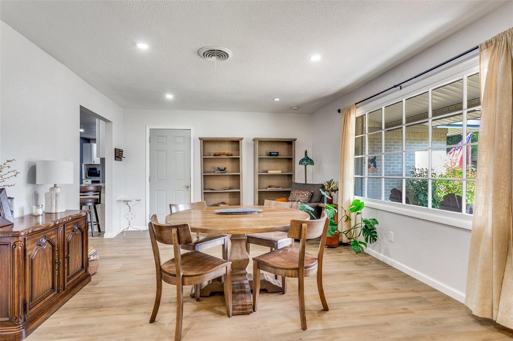 6921 Valhalla Road Fort Worth, TX 76116 - Photo 4 of 25 Dining area with light wood-style flooring, recessed lighting, and a textured ceiling