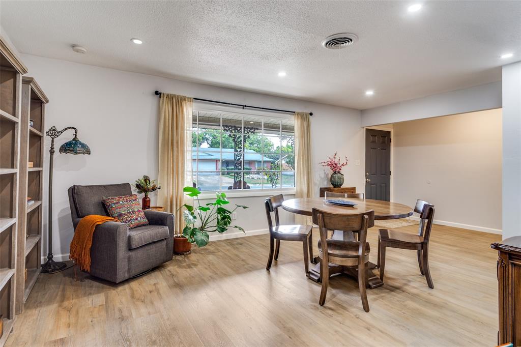 6921 Valhalla Road Fort Worth, TX 76116 - Photo 5 of 25 Dining area featuring light wood-style flooring, recessed lighting, and a textured ceiling