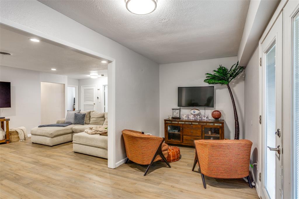 6921 Valhalla Road Fort Worth, TX 76116 - Photo 10 of 25 Living area featuring light wood-style floors, a textured ceiling, and recessed lighting