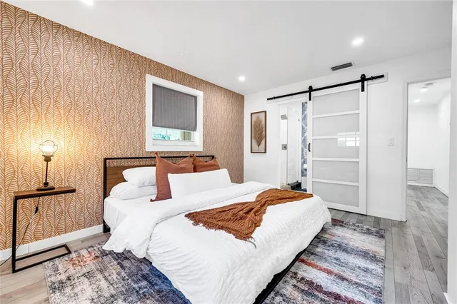 a bedroom with a bed and a walk in closet