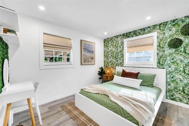 a bedroom with bed and a window