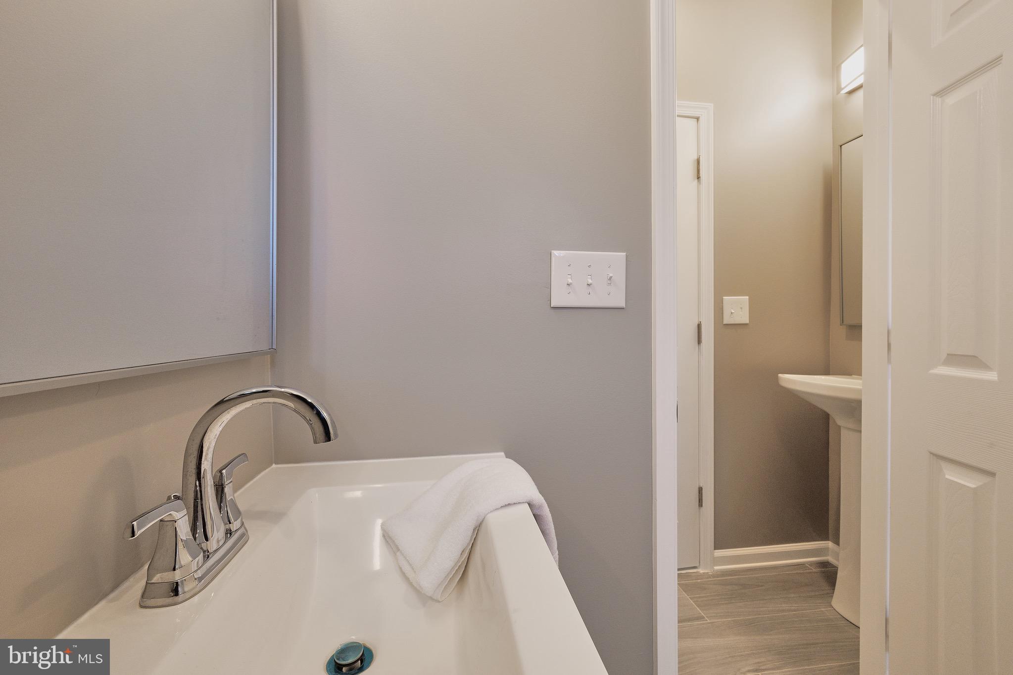 7817 Fairgreen Road Dundalk, MD 21222 - Photo 54 of 57 3RD BATH FEATURES AN EXTRA TOILET/SINK AREA