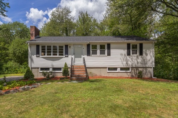 6 Hanson Road Wilmington, MA 01887 - Photo 1 of 29 a view of a house with a yard and sitting area