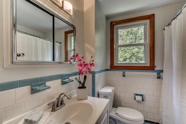 6 Hanson Road Wilmington, MA 01887 - Photo 19 of 29 a bathroom with a sink mirror and toilet