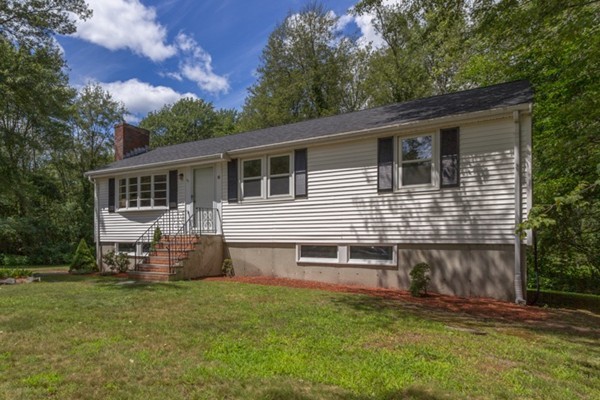 6 Hanson Road Wilmington, MA 01887 - Photo 2 of 29 front view of a house with a yard