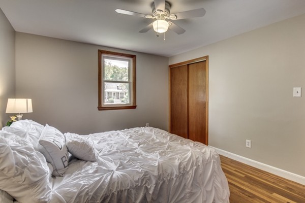 6 Hanson Road Wilmington, MA 01887 - Photo 22 of 29 a bedroom with a large bed and a window