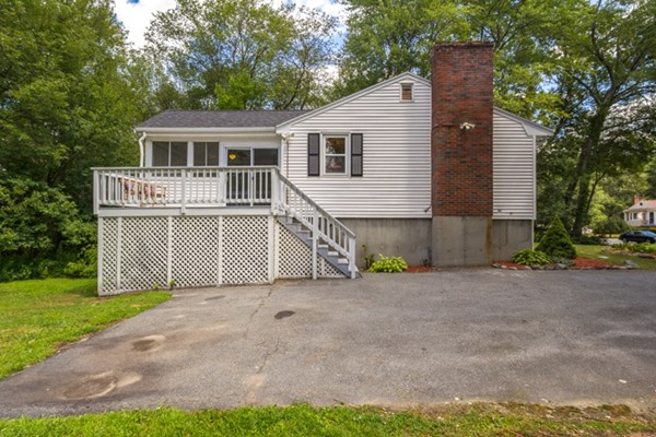 6 Hanson Road Wilmington, MA 01887 - Photo 27 of 29 a view of a house with a yard and large tree